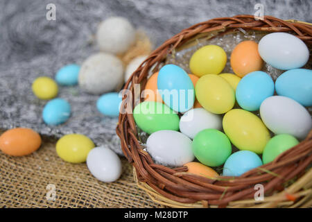 chocolate eggs of various colors with decorations Stock Photo