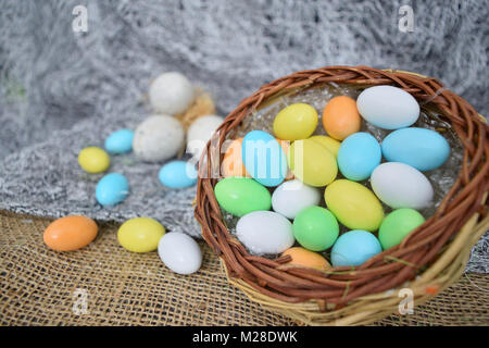 chocolate eggs of various colors with decorations Stock Photo