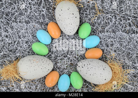 chocolate eggs of various colors with decorations Stock Photo