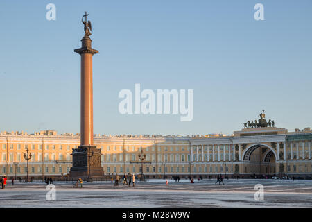 SAINT PETERSBURG, RUSSIA - JANUARY 31, 2018: People are walking in the Palace Square on the background of the Alexandria column and the arch of the Ge Stock Photo