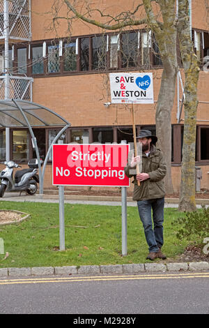 Weston-super-Mare, UK. 6th February, 2018. Demonstrators protest against the overnight closure of the accident and emergency department at Weston General Hospital. Despite assurances that the closure is only a temporary measure, it has been in effect since July 2017, and a recent proposal for a merger between Weston Area Health NHS Trust and University Hospitals Bristol NHS Foundation Trust has created further uncertainty about Weston General Hospital’s future. Keith Ramsey/Alamy Live News Stock Photo