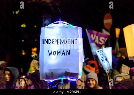 Bristol, UK. 6th Feb, 2018. The centenary of the Representation of the People Act 1918 which gave women over 30 the right to vote was celibrated tonight with a lantern parade through Bristol. Around a 1000 people turned out on a wet, snowy February night, many brought home made lanterns. Slogans promoting equal rights and pay were on many of the lanterns, reflecting that full equal rights still have to be fought for. Giant sufragette puppets,drums and a band added to the celebration. Credit: Mr Standfast/Alamy Live News Stock Photo