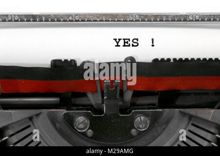 big Text YES written with the old typewriter on white sheet Stock Photo