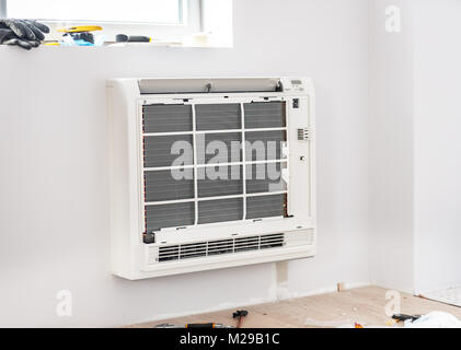 Air Conditioning Technician and A part of preparing to install new air conditioner. Stock Photo