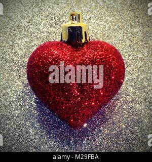one big red heart in the glitter silver  with vintage style effect Stock Photo