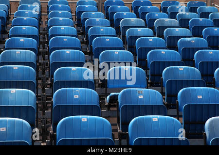 Blue rows of chairs at an outdoor concert. Audience seats. Stock Photo