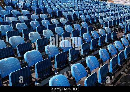 Blue rows of chairs at an outdoor concert. Audience seats. Stock Photo