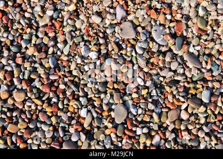 Pebbly beach background from Paphos, Cyprus. Shingle beach. Stock Photo