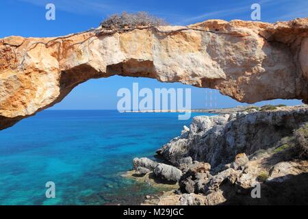 Cyprus - Mediterranean Sea coast. Natural rock bridge at Cape Greco near Ayia Napa. Stock Photo