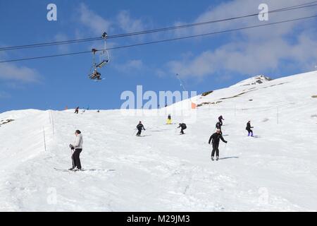 VALLOIRE, FRANCE - MARCH 23, 2015: Skiers enjoy the snow in Galibier-Thabor station in France. The station is located in Valmeinier and Valloire and h Stock Photo