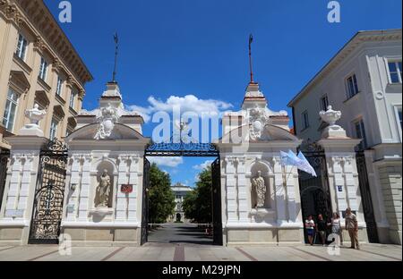 WARSAW, POLAND - JUNE 19, 2016: People walk by University of Warsaw in Poland. The public university was established in 1816 and has more than 50 thou Stock Photo