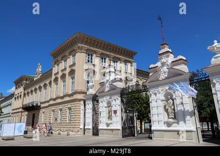 WARSAW, POLAND - JUNE 19, 2016: People walk by University of Warsaw in Poland. The public university was established in 1816 and has more than 50 thou Stock Photo