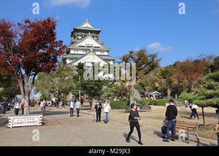 OSAKA, JAPAN - NOVEMBER 22, 2016: People visit the Castle of Osaka, Japan. It is a designated Japanese Special Historic Site. Stock Photo