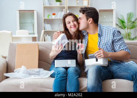 Young family playing games with virtual reality glasses Stock Photo