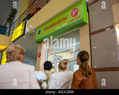 Simferopol, Russia - June 15, 2016: Passengers stand in line at the airline ticket counter S7 Airlines at the airport in Simferopol, Crimea Stock Photo