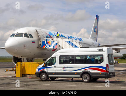 Simferopol, Russia - June 15, 2016: The car brought business class passengers to the plane  'Ural Airlines' airport of Simferopol, Crimea Stock Photo