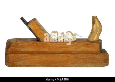 vintage plane on a white background. for wood processing. with shavings. carpenter planed wood. Stock Photo