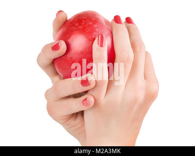 Woman hands with red nails holding red apple. Isolated on white, clipping path included Stock Photo