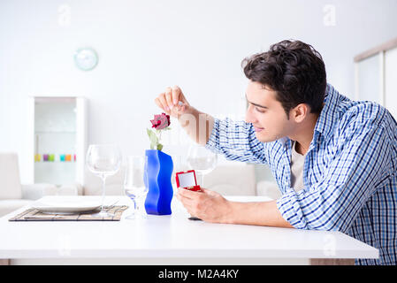 Man alone preparing for romantic date with his sweetheart Stock Photo