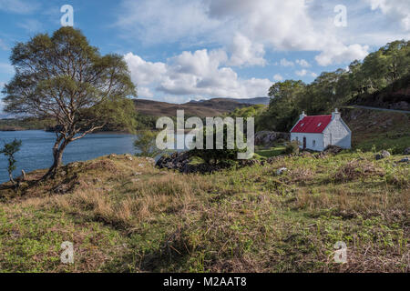 Red roofed crofters cottage near to Shieldaig, Wester Ross, Scotland. UK Stock Photo