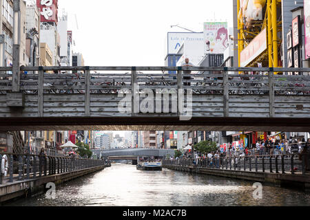 Wooden Bridge and Ebisu Bridge view from Dotombori Canal at sunset, Osaka, Osaka Prefecture, Kansai region of Japan Stock Photo