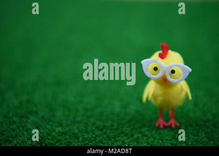 Easter time with mini yellow chick decorations on grass Stock Photo