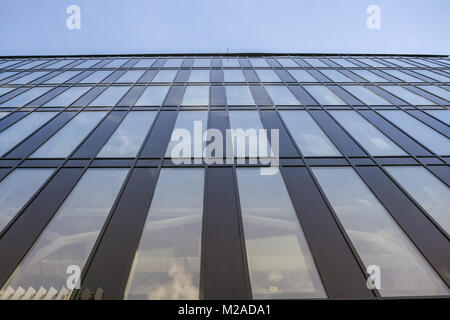 Close-up modern office building with mirror windows. Perspective view.