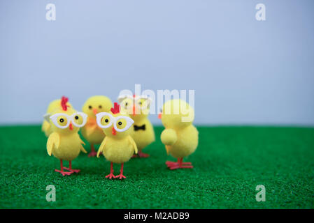 Easter time with mini yellow chick decorations on grass Stock Photo
