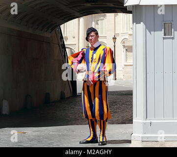 VATICAN CITY VATICAN - MAY 17, 2012: Famous Swiss Guard guarding the entrance to the Vatican City Stock Photo