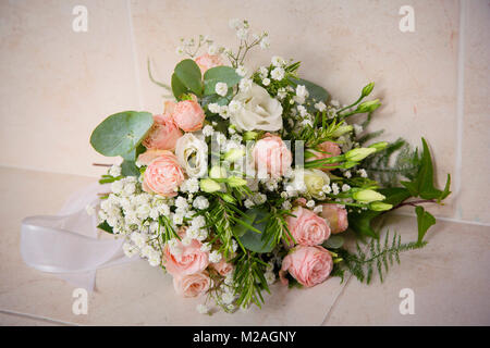 Wedding bouquet with pink and white roses and gypsophila Stock Photo