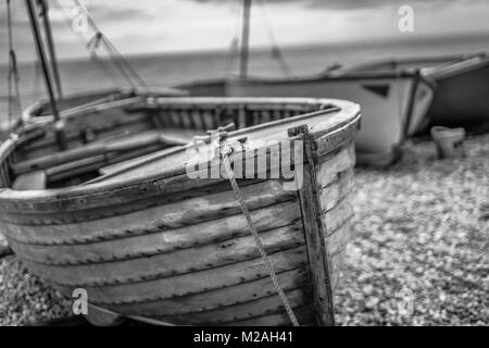Boats at Beer, Dorset, UK along the Jurassic Coast. In black and white Stock Photo