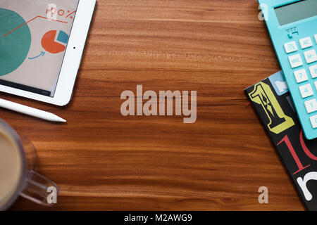photo of desktop with digital tablet, slili, and calculator Stock Photo
