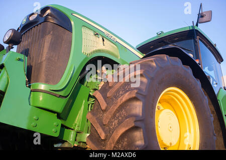 Badajoz, Spain - August 6th, 2017: Row Crop Tractor John Deere 8320. Low side view Stock Photo