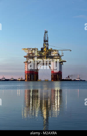 'Big Foot'  Chevron's Deep Ocean Platform departs from Kiewit,  oil & natural gas drill rig, at dawn, departed Ingleside 4 am January 30, 2018. Stock Photo