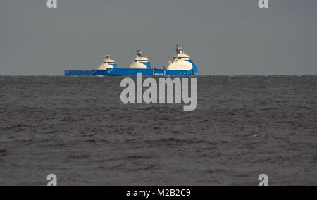 Three Medium Sized Oil Platform Supply Vessels, Nao Viking, Prosper and Power. Moored Offshore Aberdeen, North Sea, Scotland, UK. Stock Photo