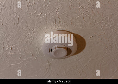 smoke alarm on a ceiling Stock Photo