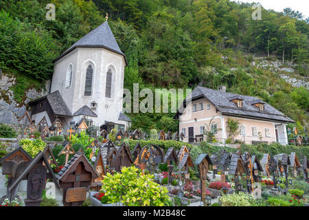 HALLSTATT, AUSTRIA - SEPTEMBER 14, 2016 : Beinhaus Ossuary known as bone house with small cemetery in the garden, in Hallstatt on Alp Mountains. Stock Photo