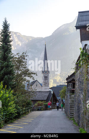 HALLSTATT, AUSTRIA - SEPTEMBER 14, 2016 : Hallstatt village with historic mountain houses around, among Alp Mountains in Salzkammergut area. Stock Photo