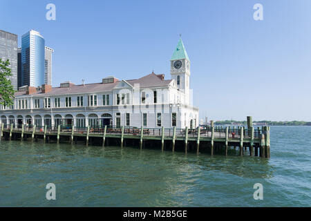 New York, NY, USA - June 06, 2015: Pier A Harbor House with restaurant situated on the Hudson River at Battery Park, Lower Manhattan. Modern skyscrape Stock Photo