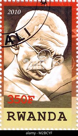 RWANDA - CIRCA 2010: A stamp printed in Rwanda shows Mahatma Gandhi, series, circa 2010 Stock Photo