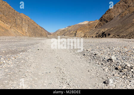 mountain road in the valley of the Kali Gandaki river, lower Mustang Stock Photo