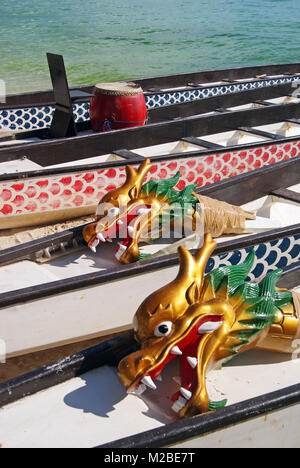 Dragon Boats at Rest on White Beach Stock Photo