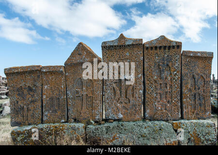 A khachkar or Armenian cross-stone is a carved, memorial stele bearing a cross, additional motifs such as rosettes, interlaces, and botanical motifs. Stock Photo
