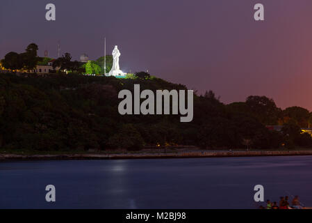 El Cristo de La Habana or Christ of Havana statue overlooking Havana Bay at night in Casablanca, Havana, Cuba. Stock Photo