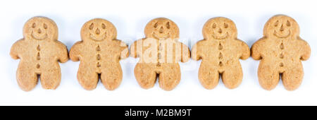group of gingerbread man standing together on a white background Stock Photo