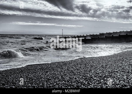 Black and white shot of a cold winters day on Eastbourne Beach Stock Photo