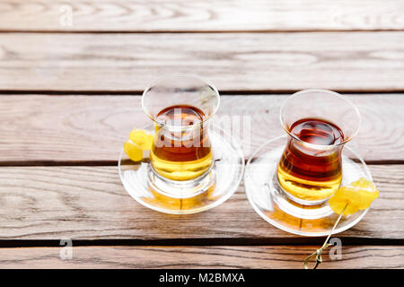 Two cups of traditional Turkish tea on a table in a street cafe in Istanbul, Turkey. Stock Photo