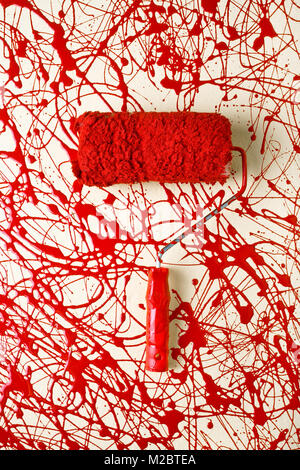 Roller paint brush with red paint Stock Photo