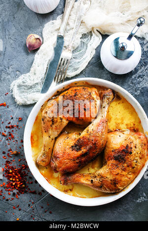baked chicken legs with salt and spice on the plate Stock Photo