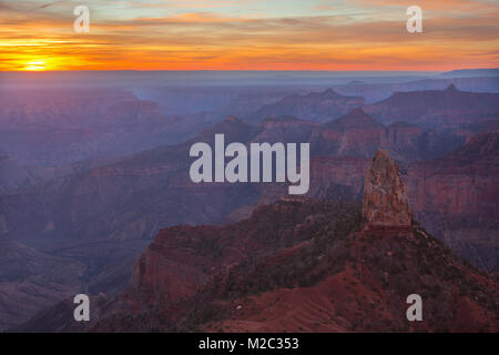 Sunrise over the Grand Canyon from Point Imperial in Grand Canyon National Park, with Mount Hayden in the foreground. Arizona, USA Stock Photo